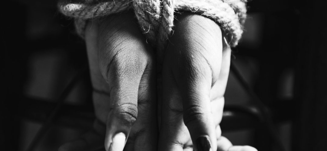 Hands tied with a rope